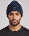 Peak Performance Cornice Beanie Hat in Blue Shadow — on model