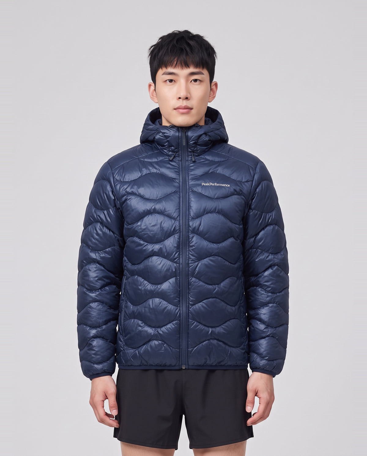Men's Peak Performance Helium Down Hood Jacket in Blue Shadow — on model