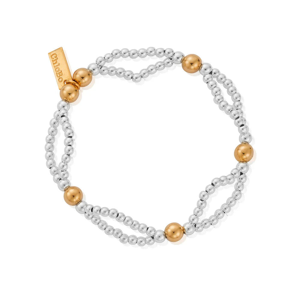 Beaded bracelet with gold accents.