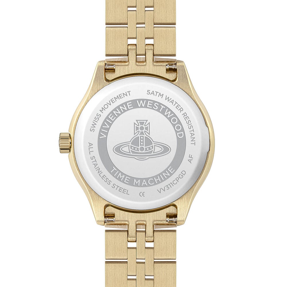 Close-up of the back of a gold Vivienne Westwood watch with a silver emblem.