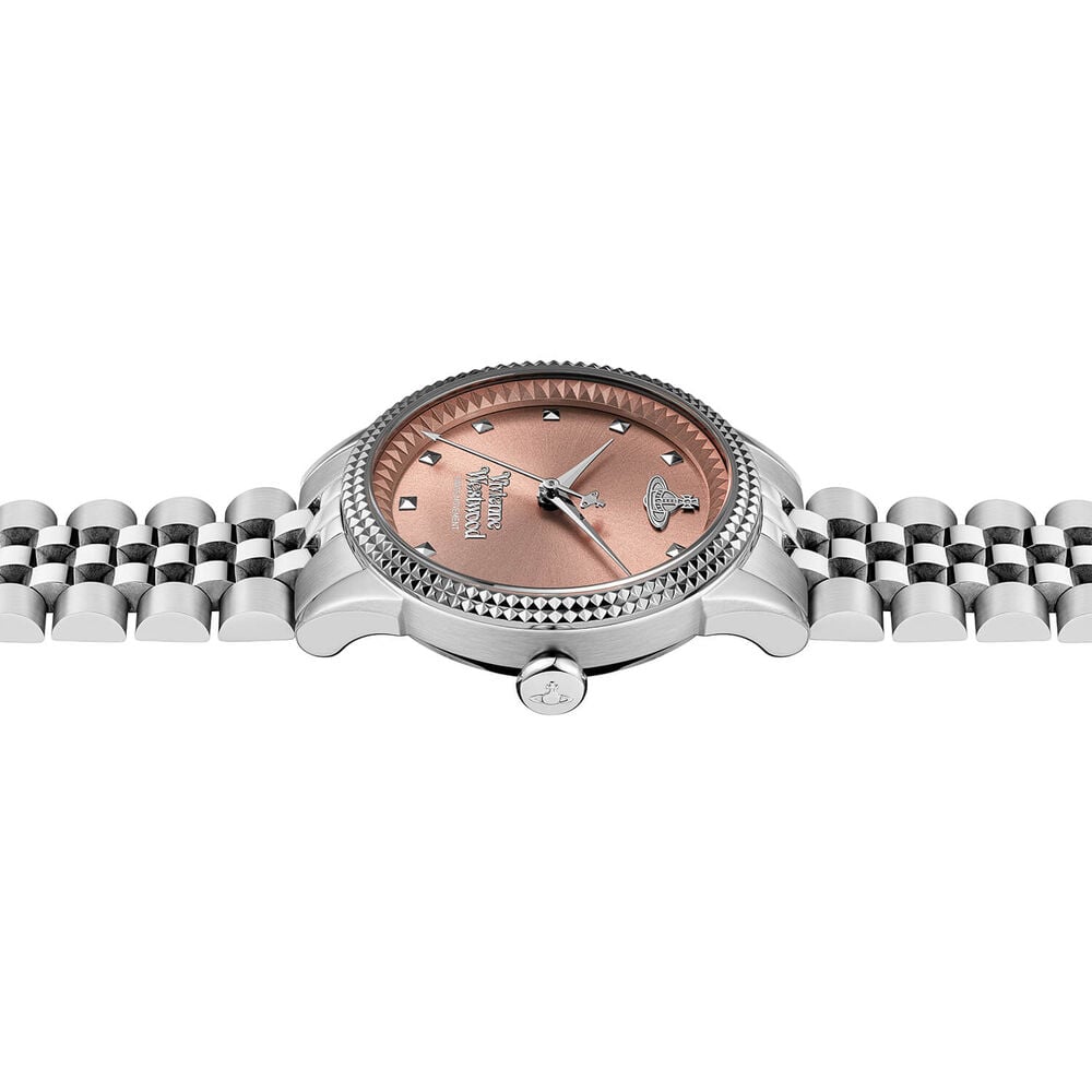 Wristwatch with silver band and rose gold face.
