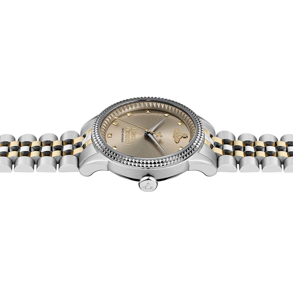 Close-up of a two-tone silver and gold wristwatch.