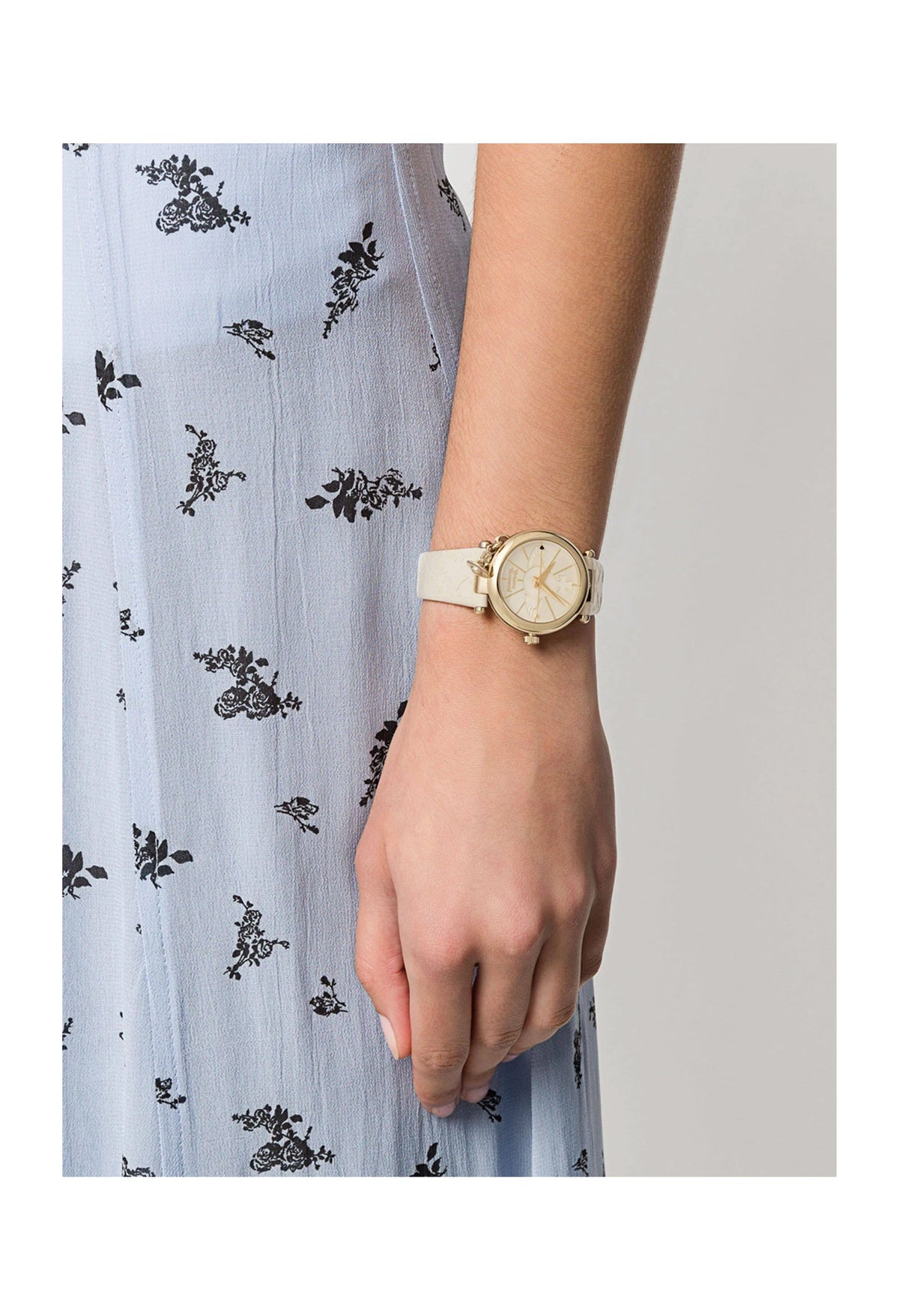 Ladies Vivienne Westwood watch worn on wrist. Demonstrates the fit and style of this luxury timepiece.